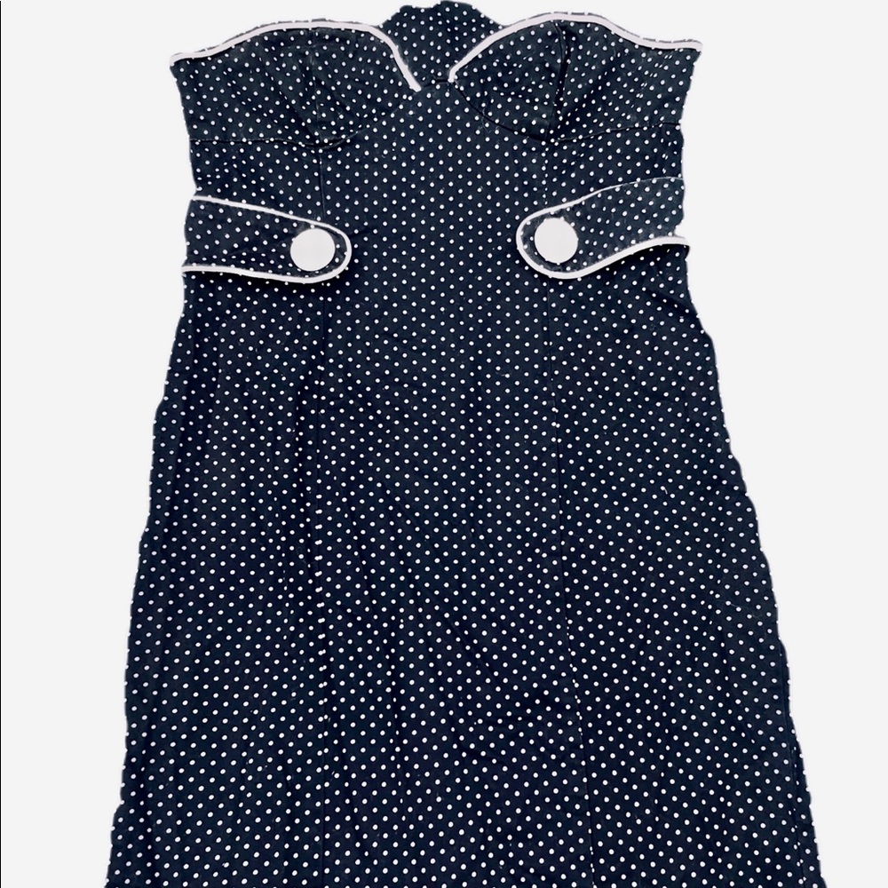 sleeveless navy dress with white polka dots